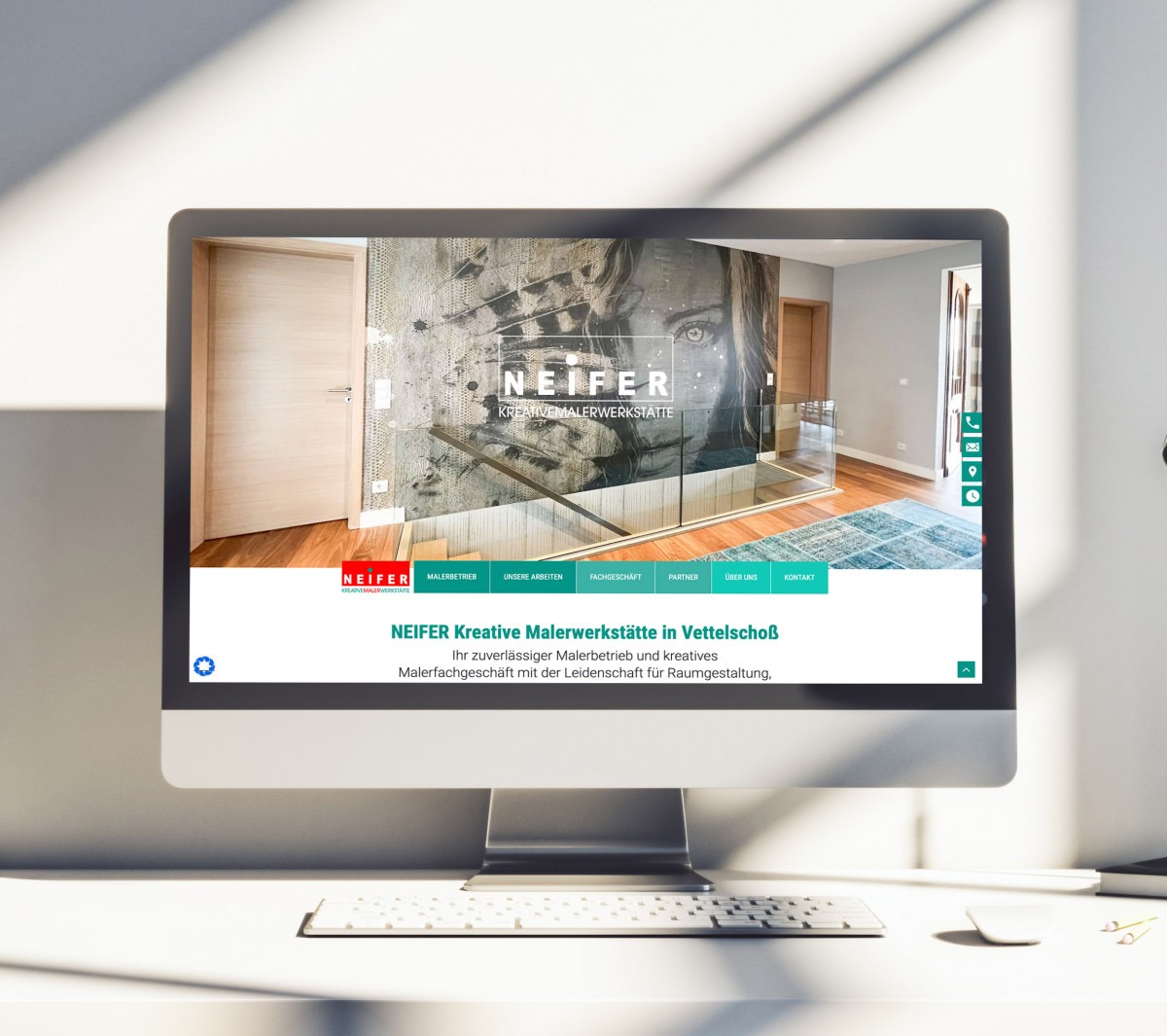Computerbildschirm zeigt Website von NEIFER Kreative Malerwerkstätte mit großem Wandbild und Menüleiste in verschiedenen Farben.